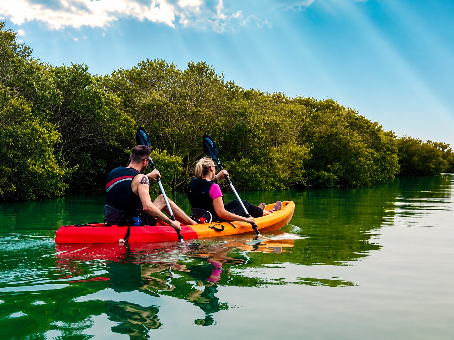 A Couple Enjoying Kayaking In Al Thakira