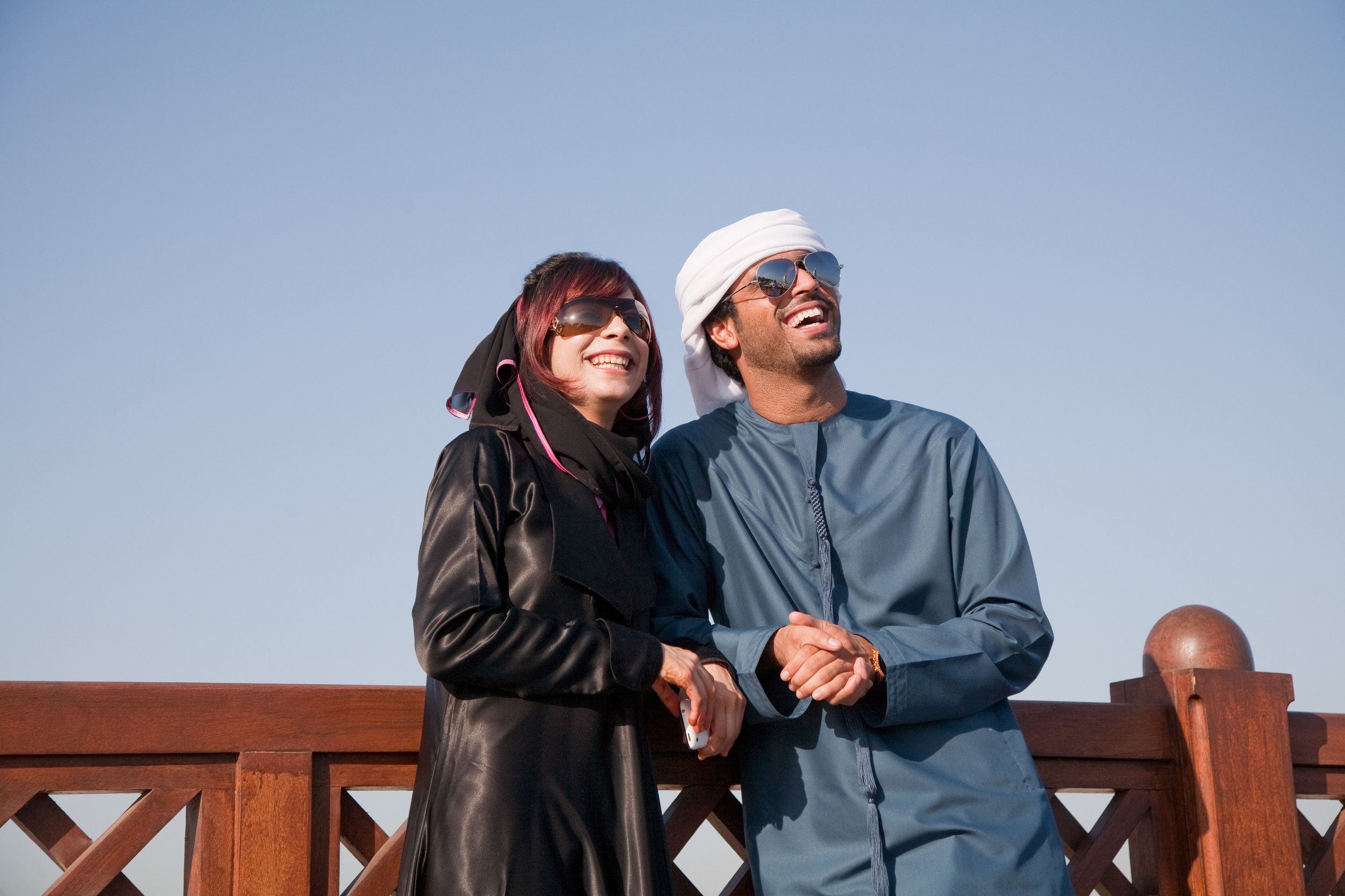 Middle Eastern people and fence