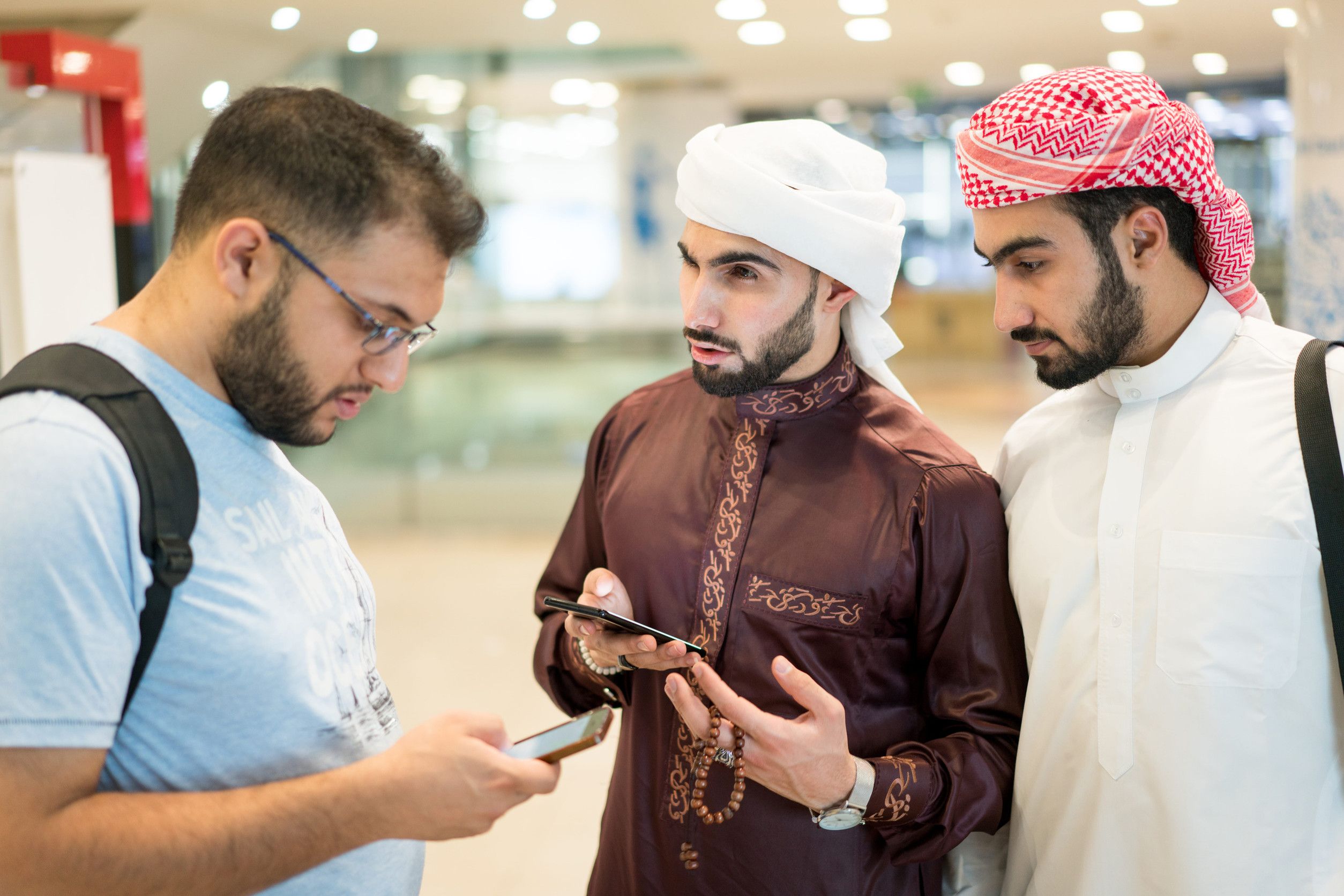 Qatar Nationals Conversing With Tourist