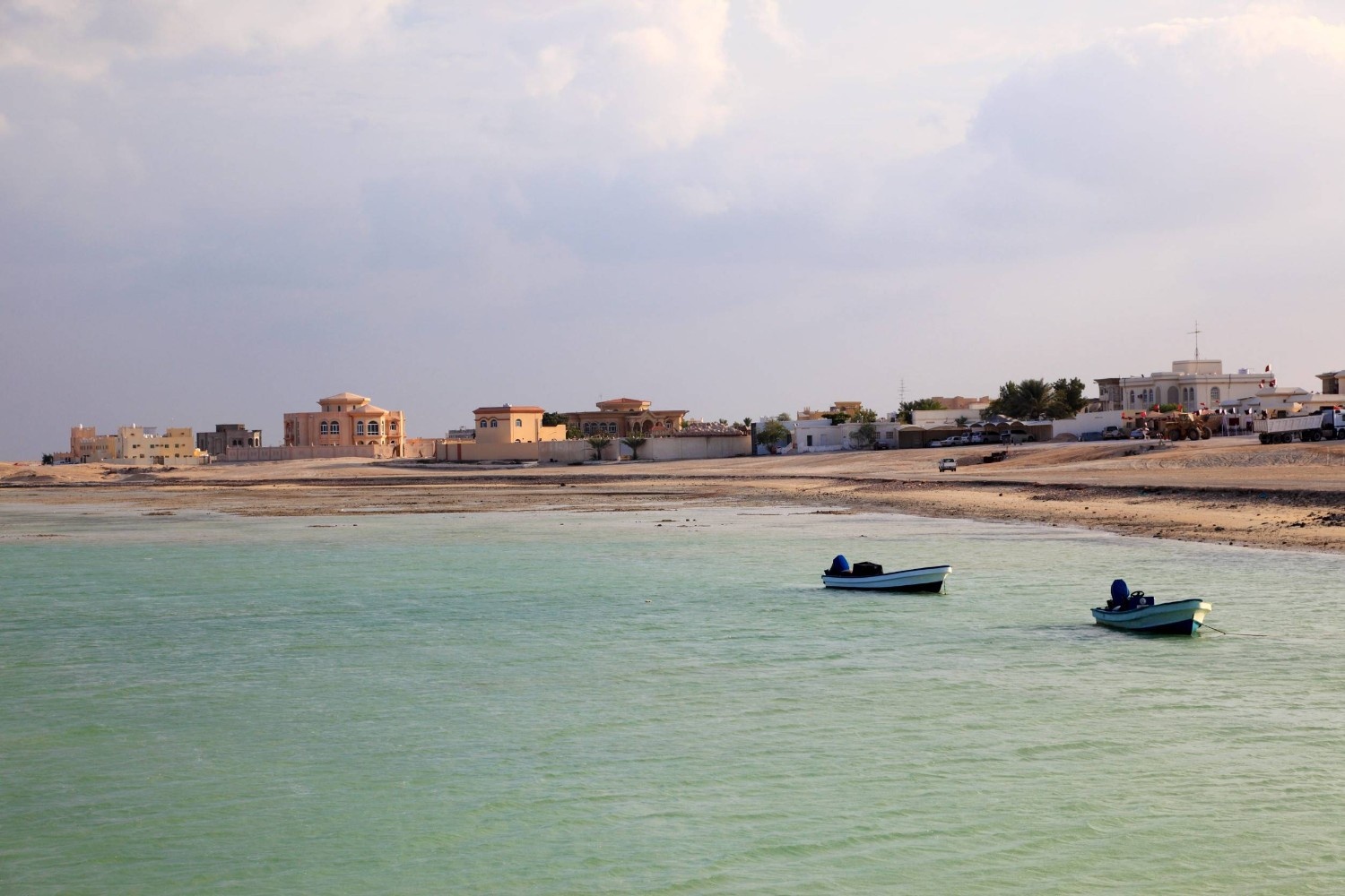 The Beach Of Khor Al Adaid With Boats And Houses