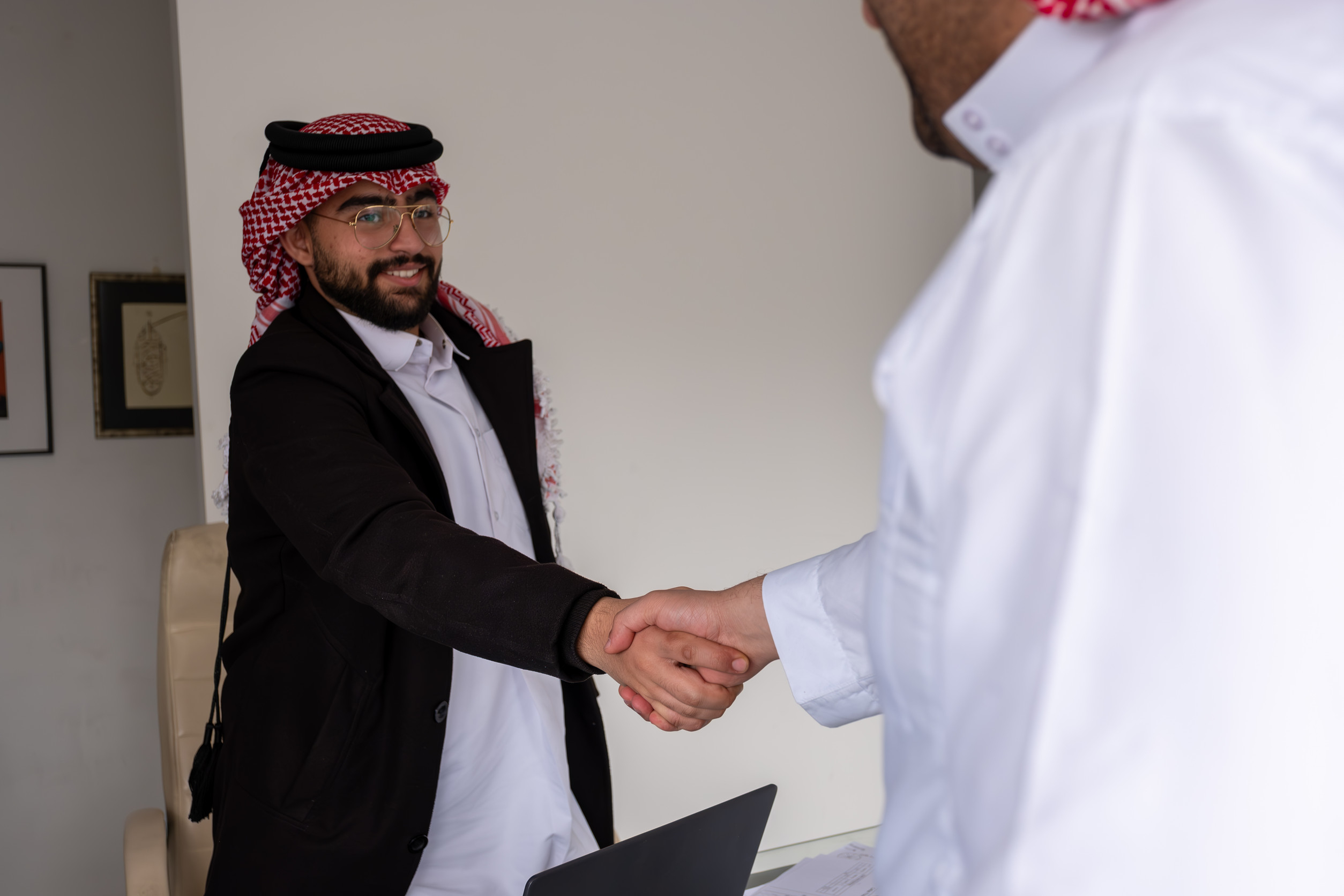 Two Arab Men Shaking Hands