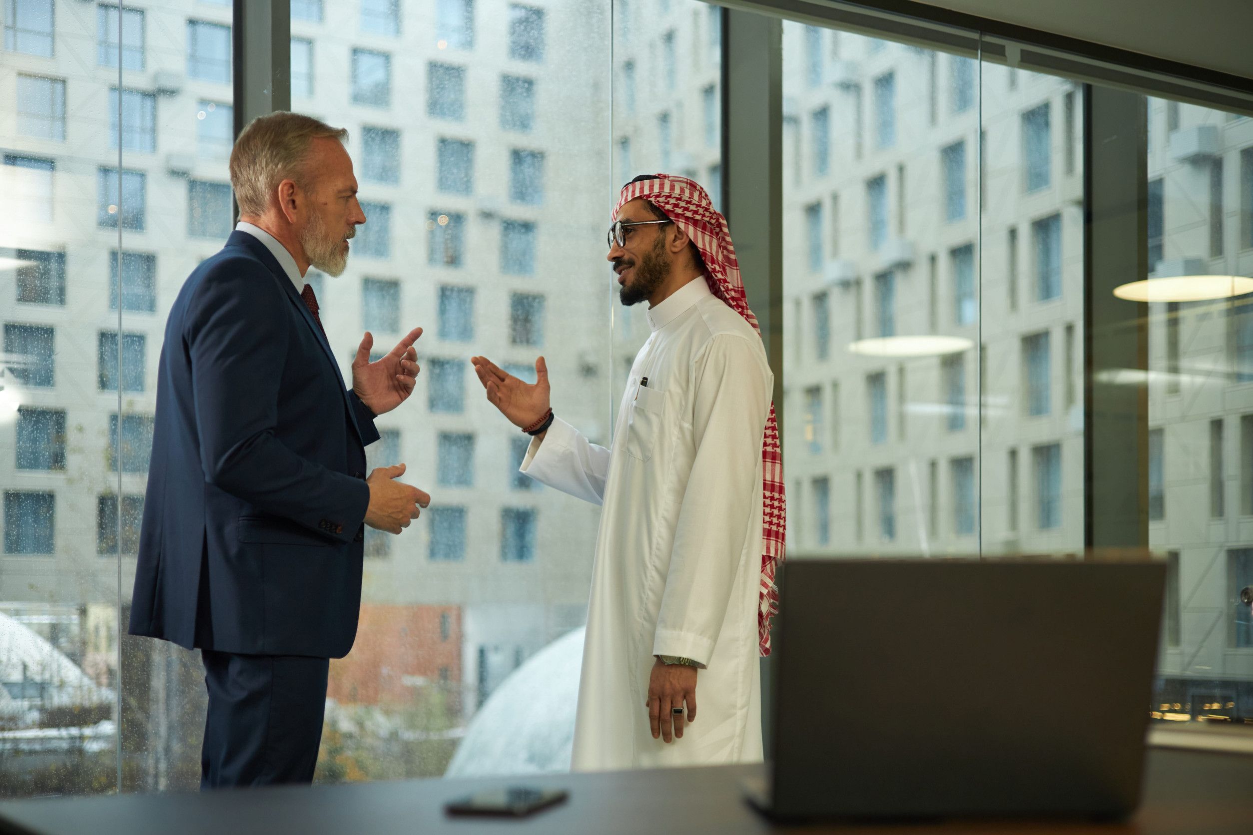 Two Diverse Men Discussing A Project