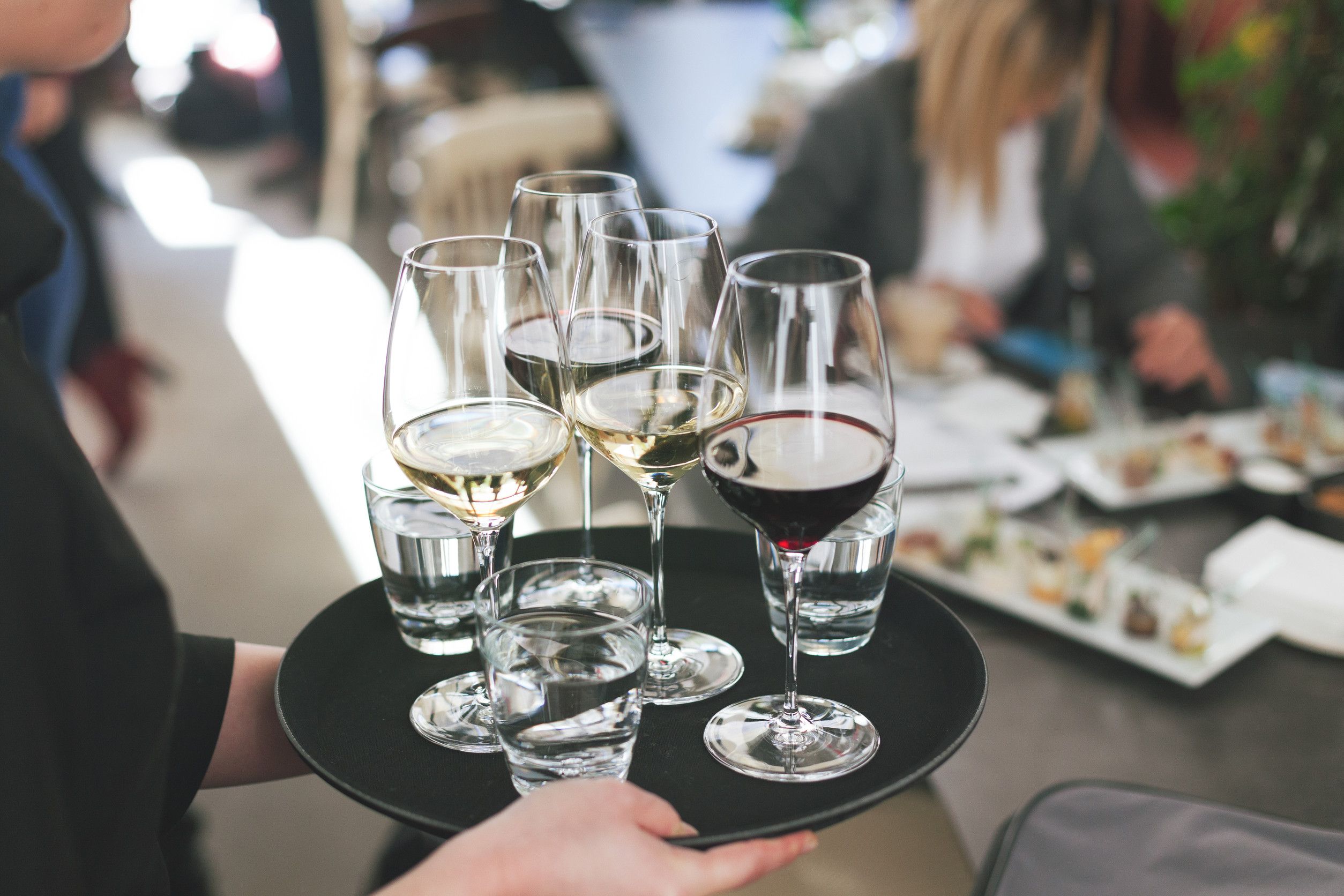Waitress At A Hotel Serving Alcohol